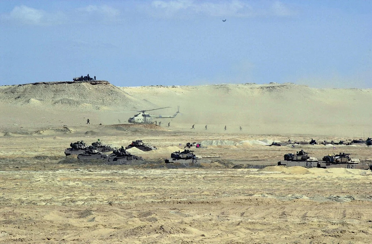 Egyptian Air Force Mi-17 helicopters dropping off infantry troops during a live-fire exercise