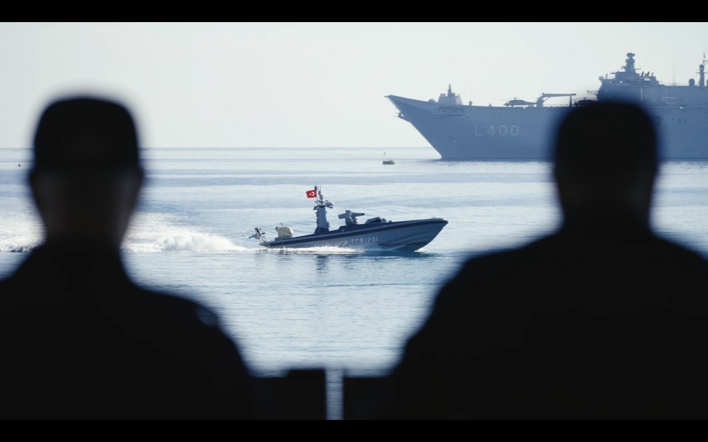 Observers watch unmanned surface vessels during TURNAs-2026