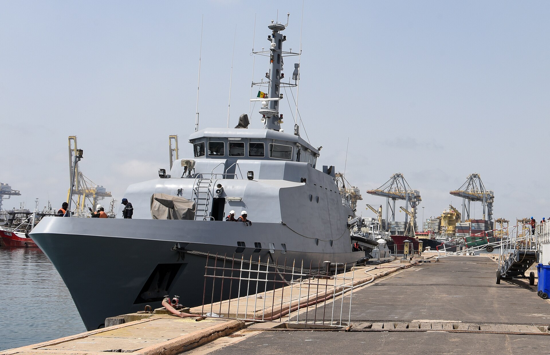 Senegalese Navy patrol ship Fouladou moored in the port of Dakar in July 2022 with container cranes behind