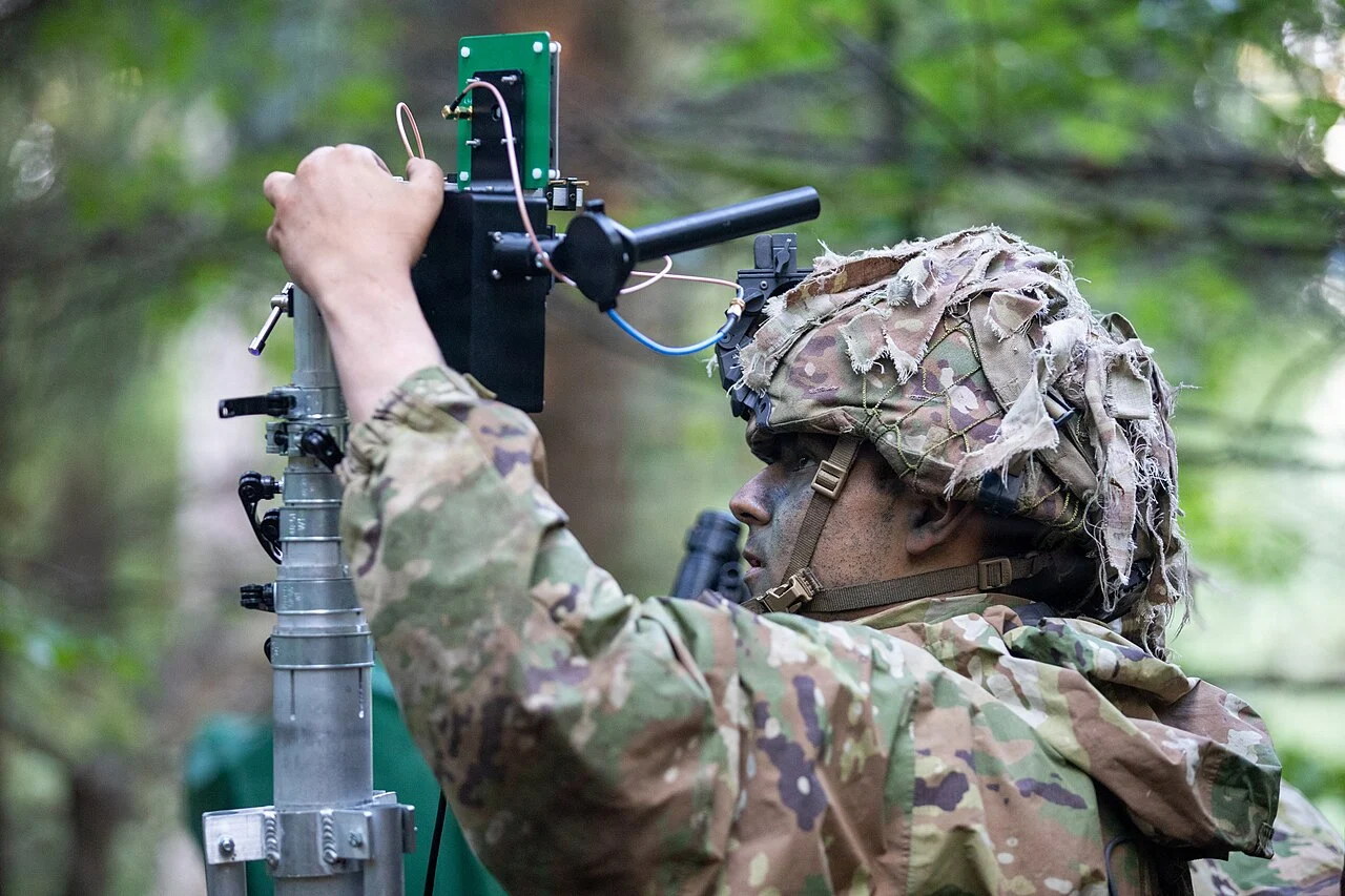 US Army soldier operating a counter-drone jamming system during training