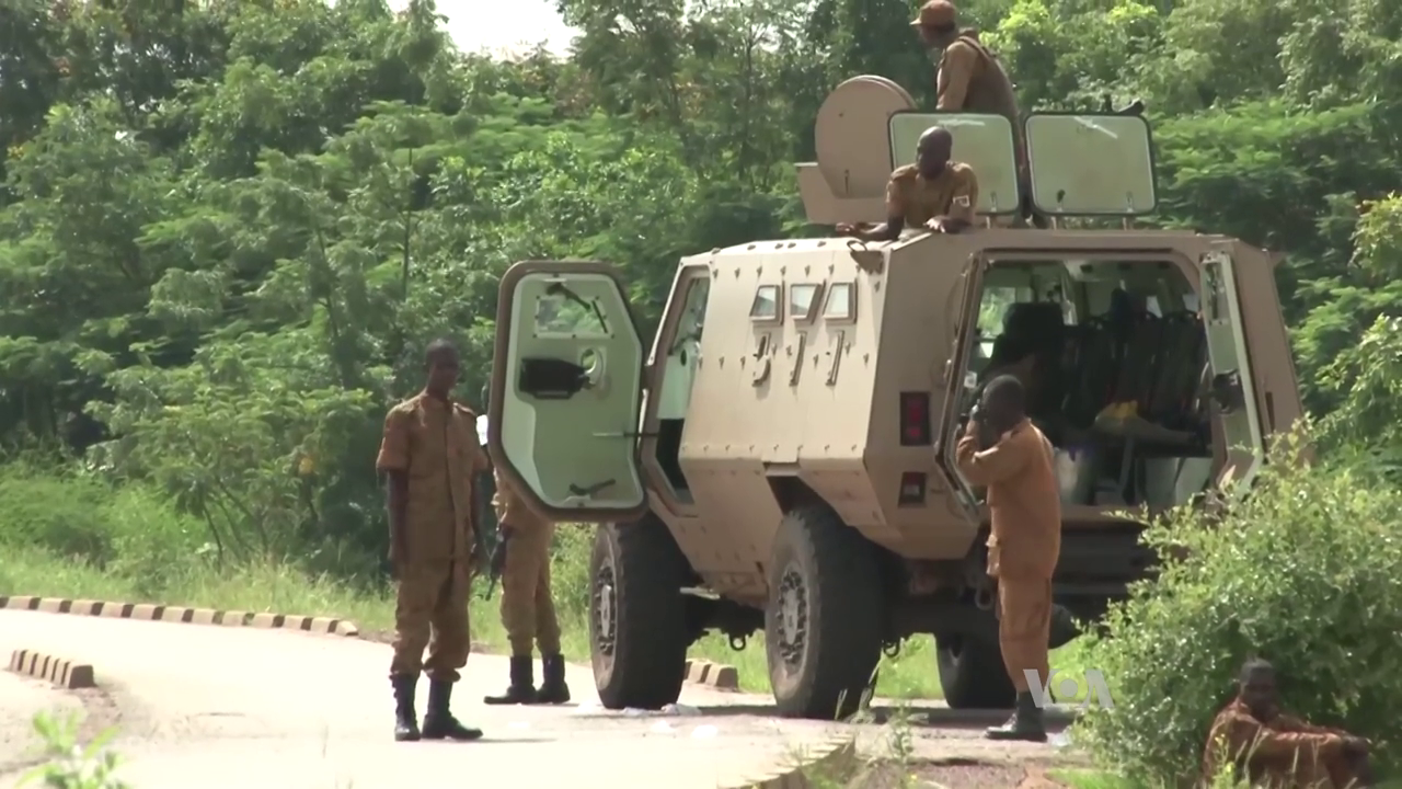 Burkinabè Army ACMAT Bastion armoured personnel carrier with soldiers on a road near Ouagadougou in 2015
